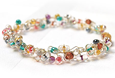 Angel wire and cluster bead bracelet - Pretty cluster of clear beads, with multi-coloured centres, woven together with thin gold wire. Strung onto a single wire. Magnetic clasp. Matching bracelet and earrings available.