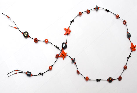Alison mid-length lariat - Fun knotted lariat necklace with star and flower buttons, interspersed with mixed beads.