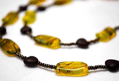 Amber necklace - Unusual rectangular Czech glass beads strung with metallic seed beads and chocolate brown hearts which can be worn long, as a single strand, or wrapped round twice. Screw clasp.