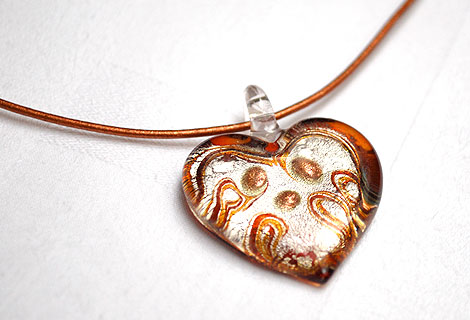 Sara heart pendant - Pretty glass heart pendant in silver, gold and red, strung onto leather cord. Sterling silver ‘S’ clasp.