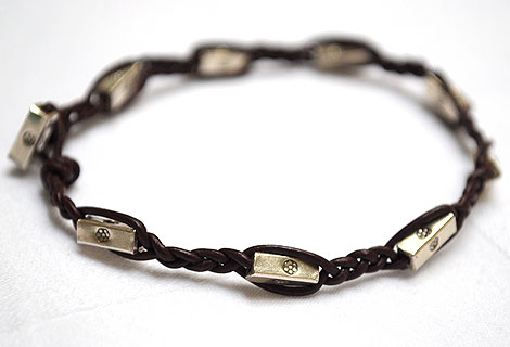 Sam plaited leather bracelet - Exquisite bracelet of brown plaited leather and sterling silver cuboid beads with single engraved flower motif. Fastened by sterling silver toggle bead and loop.
