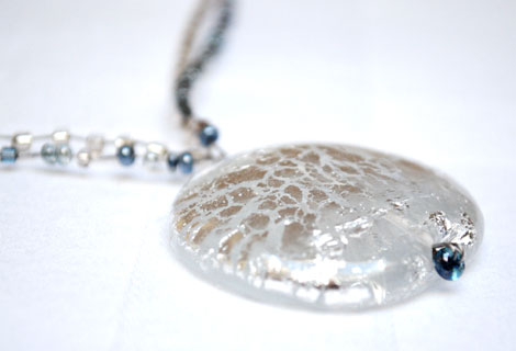 Glacier disc pendant - A beautiful glass pendant adorned with ‘cracked’ silver foil, hanging from a double length of ‘crinkle’ wire, threaded with silver, grey and clear seed beads. Magnetic clasp.